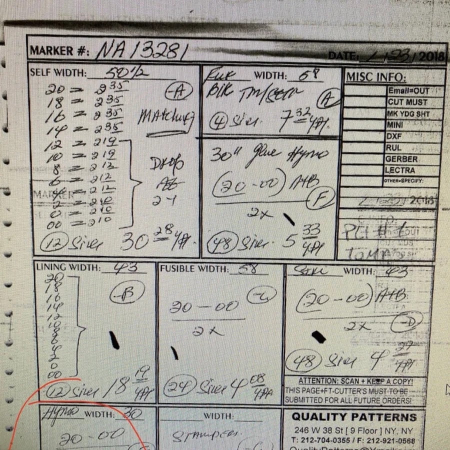 Handwritten production and cutting notes on a garment marker sheet
