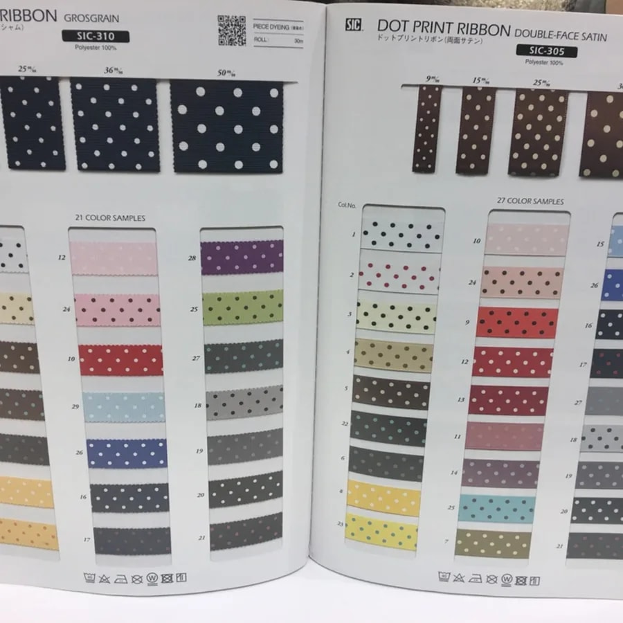 Open trim book displaying rows of colorful dotted grosgrain ribbon samples
