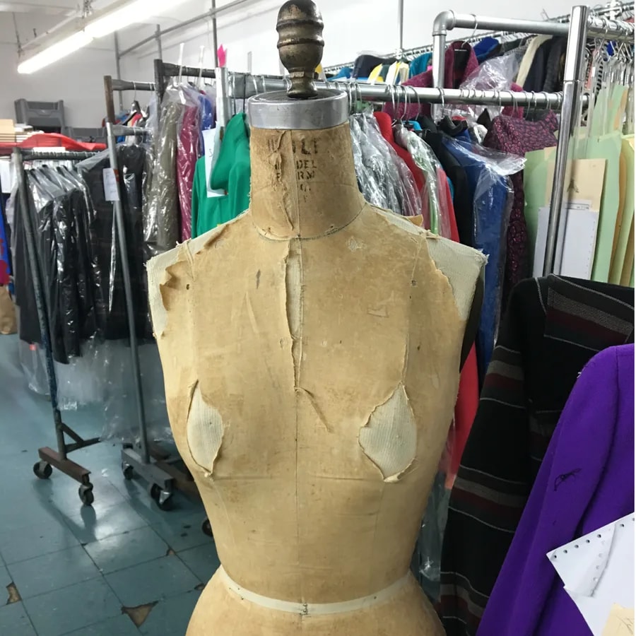 A vintage dress form in the garment workroom