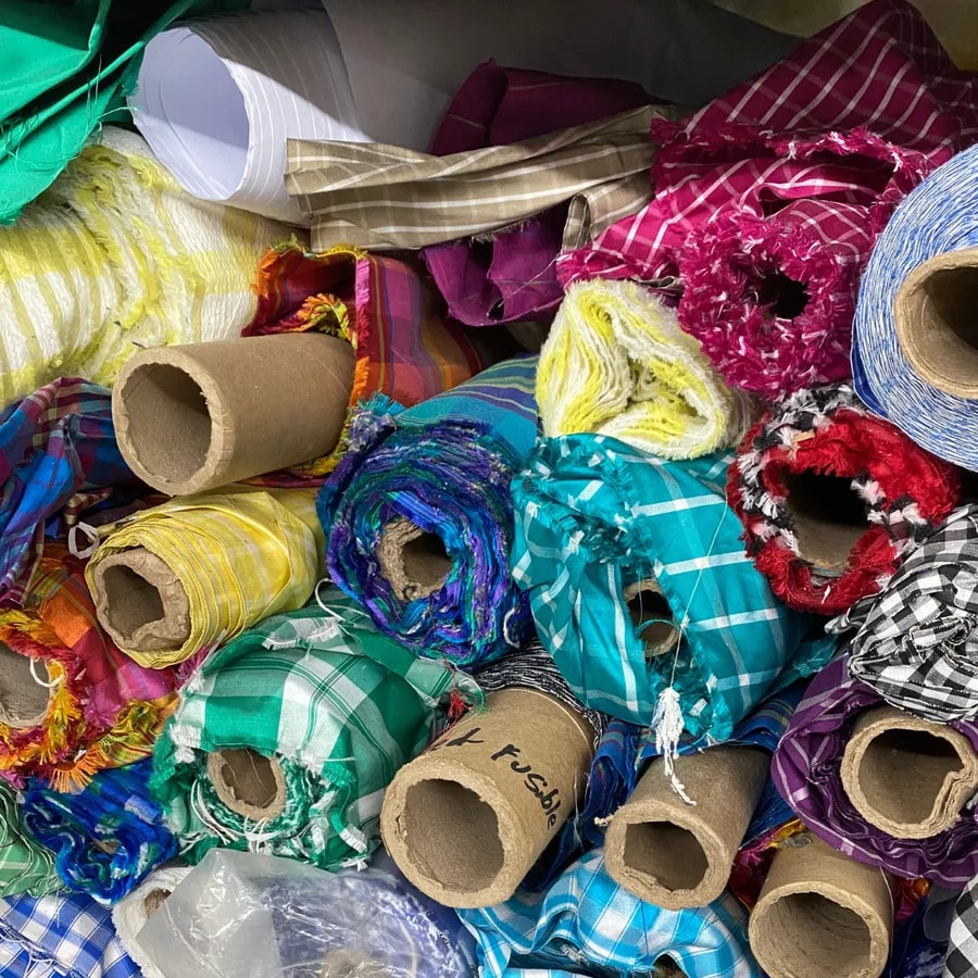 Colorful rolls of fabric used in garment production