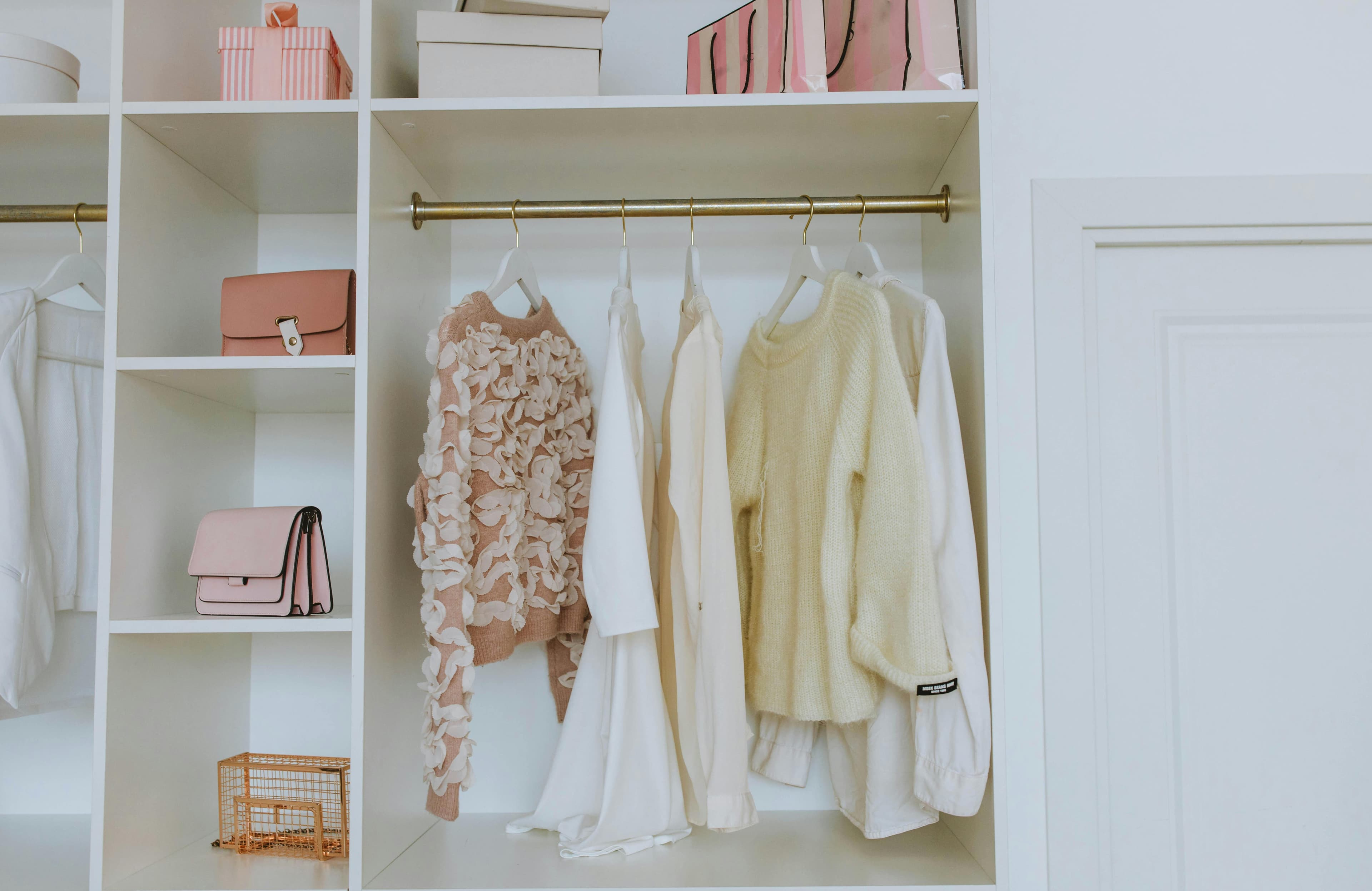 Soft neutral wardrobe with clothes and accessories