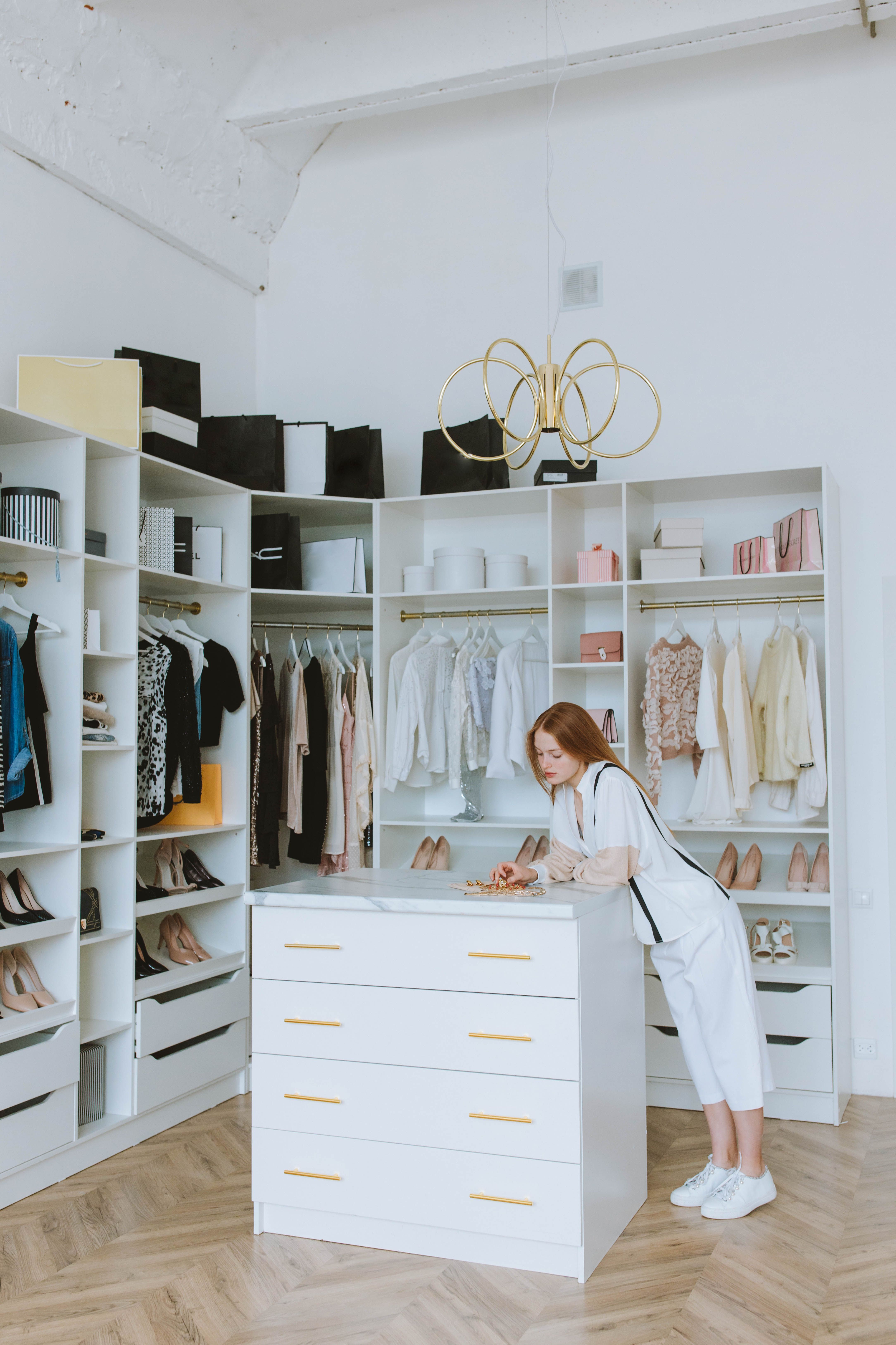 Closet edit with garments organized for review