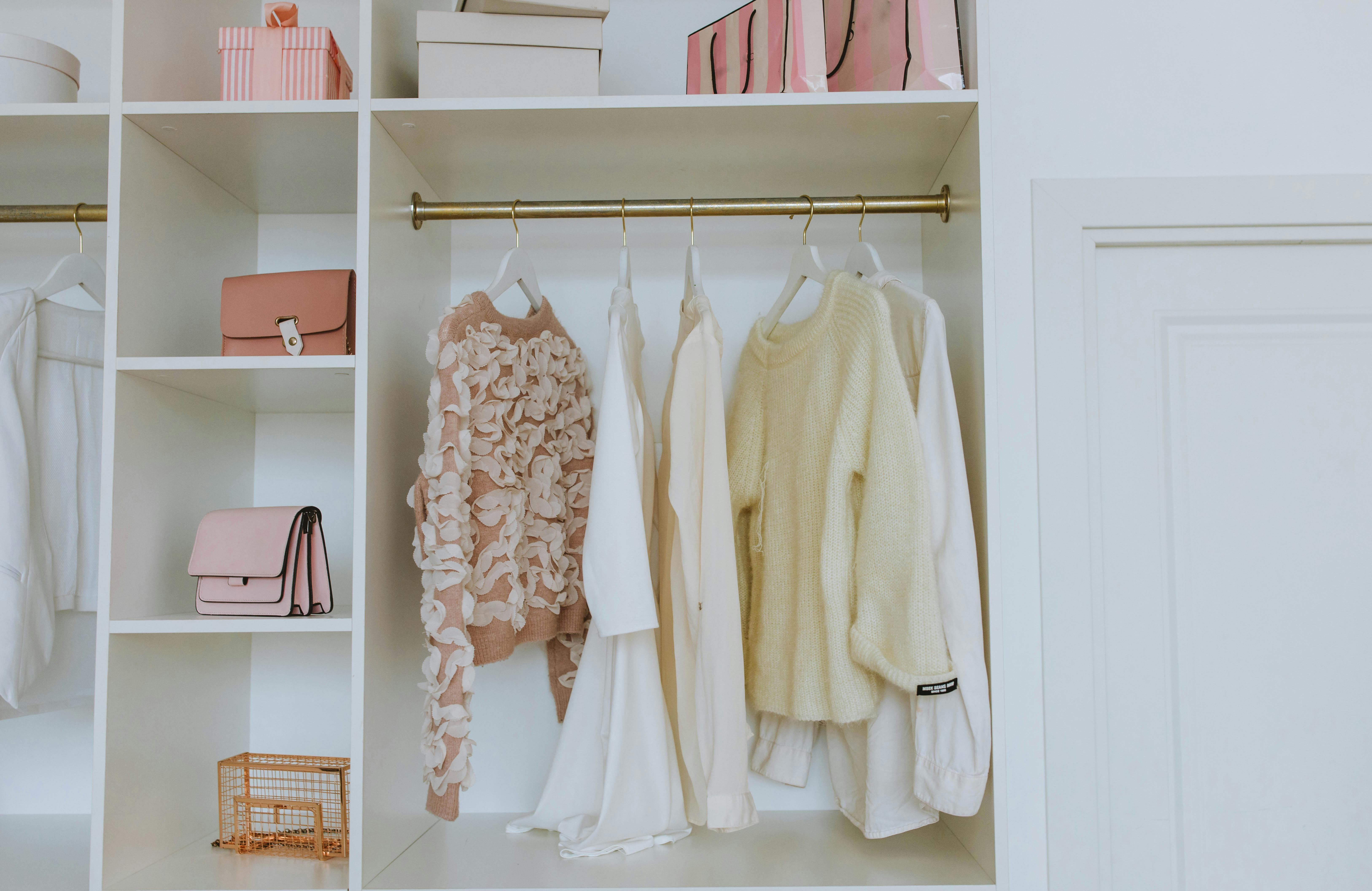 Neutral wardrobe arranged by shape, texture, and proportion